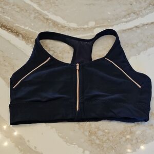 Athleta Women's Navy Sports Bra with Rose Gold Zipper and Accents.